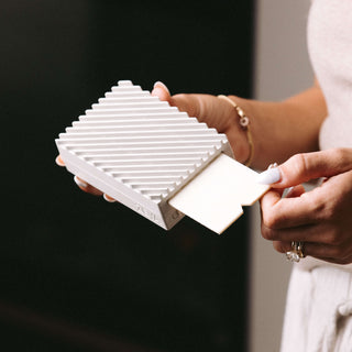 ZEYA Portable Diffuser styled on a shelf in a home interior
