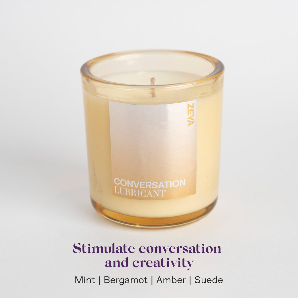 ZEYA Conversation candle, a hand poured coconut soy candle with lifting mint, charred bergamot, warm amber, soft suede notes