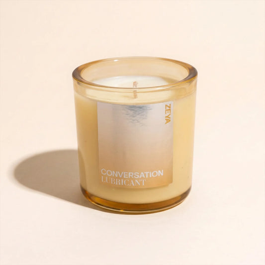 ZEYA Conversation candle styled with its scent notes of mint, bergamot, amber and suede